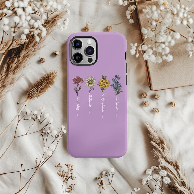 May include: A lavender phone case featuring a floral design with the names "Savannah", "Stephanie", "Taylor", and "Holley" written beneath the flowers.