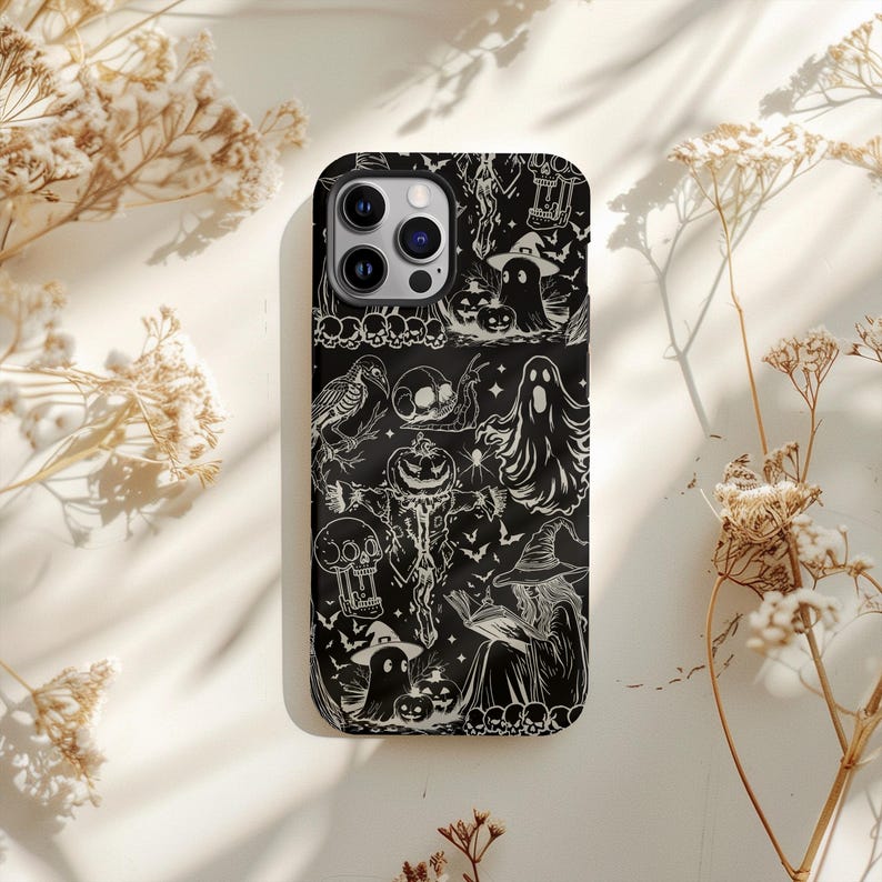 May include: Black phone case featuring a Halloween-themed design. The case displays a repeating pattern of spooky illustrations, including ghosts, pumpkins, skulls, and a witch. The design is in white against a black background.