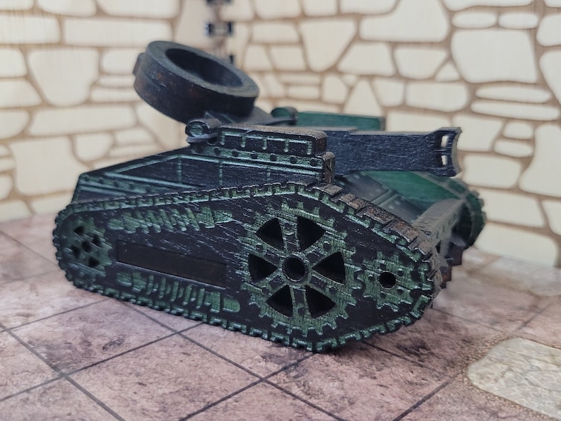 May include: A black and green toy tank with a large, round, black turret. The tank has a detailed design with gears and tracks.