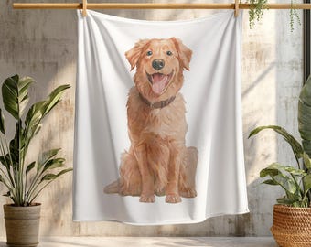 May include: A white throw blanket featuring a watercolour illustration of a golden retriever dog sitting and looking at the camera. The dog has a happy expression and is sitting on a white background.