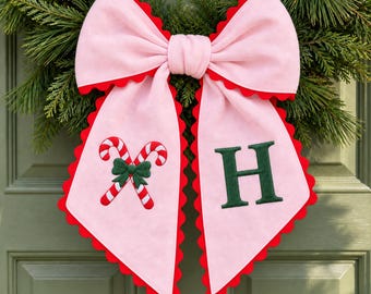 Pink Candy Cane Wreath Sash with a Personalized Surname Initial