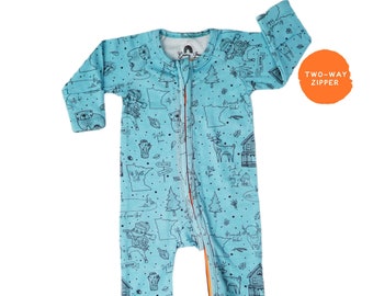 May include: A light blue baby sleeper with a two-way zipper. The sleeper features a repeating pattern of black line drawings of animals, trees, maps, and buildings. The text "Two-Way Zipper" is in an orange circle.