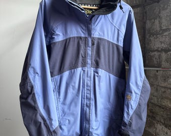 Chaqueta con capucha vintage Mountain Hardwear, marca de exteriores de los años 90, azul suave y gris, talla 8/mediana