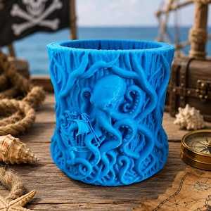 May include: A vibrant blue, cylindrical container with an intricate design of an octopus, a ship, and swirling tentacles. The container is set against a nautical backdrop, suggesting a pirate or sea-themed product. The container is made of a solid material.