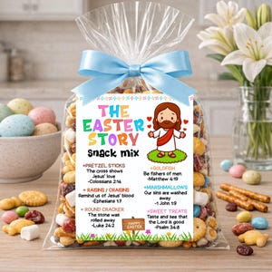 May include: A cellophane bag filled with a snack mix, tied with a light blue ribbon. The bag has a colourful label with the text "The Easter Story Snack Mix" and an illustration of Jesus. Various snacks are scattered around the bag.