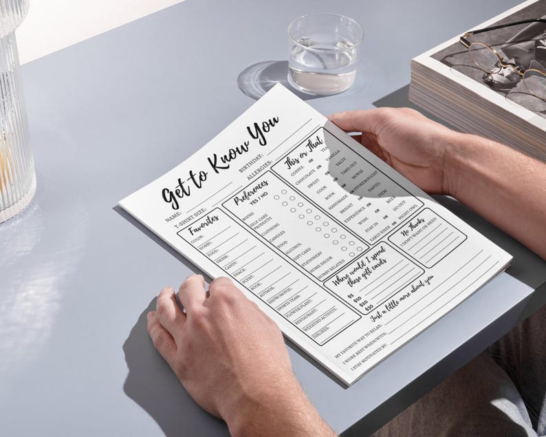 May include: A black and white printable "Get to Know You" questionnaire with sections for name, t-shirt size, birthday, allergies, favorites, preferences, and "This or That".