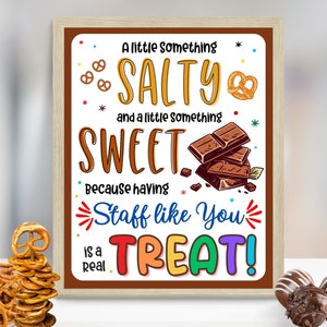 May include: A brown framed sign with a white background and colorful text that reads "A little something SALTY and a little something SWEET because having Staff like You is a real TREAT!" The sign is decorated with pretzel and chocolate illustrations.