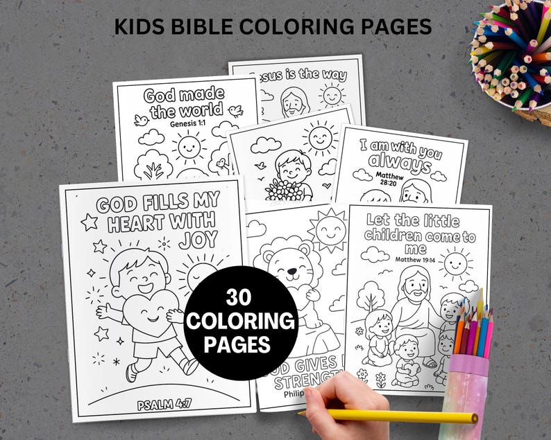 May include: A set of children's Bible coloring pages featuring illustrations and Bible verses. The pages are in black and white, with the text "KIDS BIBLE COLORING PAGES" at the top. A pencil is held near the pages, and a container of coloured pencils is visible.
