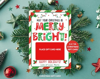 May include: A 5x7 inch Christmas gift card with a red and green border. The card features the text "May Your Christmas Be Merry and Bright!" in festive colors. A red rectangle is labeled "Place Gift Card Here."