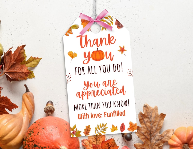 May include: A white gift tag with a pink bow and the words "Thank you for all you do! You are appreciated more than you know! With love: Funfilled" in orange and red. The tag is decorated with fall leaves and a pumpkin.