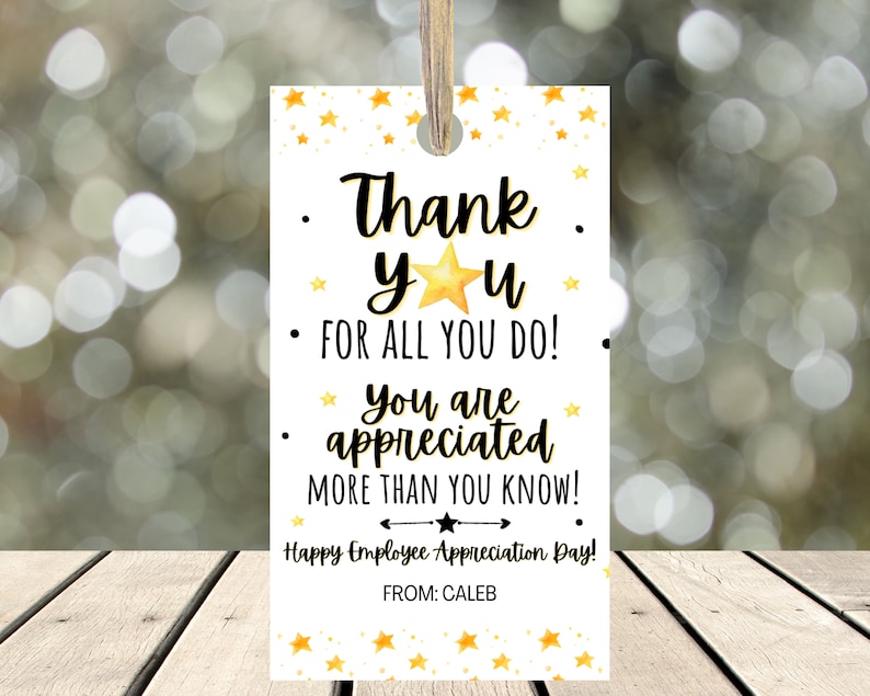 May include: A white tag with gold stars and the text "Thank yu FOR ALL YOU DO! * You are appreciated MORE THAN YOU KNOW! Happy Employee Appreciation Day! FROM: CALEB"