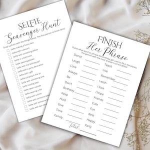 May include: Two white paper sheets with black text. One sheet is a "Selfie Scavenger Hunt" game with a list of selfie prompts. The other is a "Finish Her Phrase" game with fill-in-the-blank prompts.
