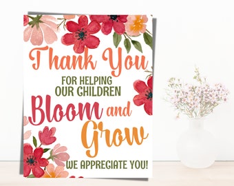 May include: Thank you for helping our children bloom and grow. We appreciate you!  A printable card with a floral design and a message of appreciation for teachers or staff.