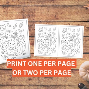 May include: Two black and white coloring pages featuring a cornucopia design with smiling apples, pumpkins, and corn. The text on the image reads "PRINT ONE PER PAGE OR TWO PER PAGE". The pages are on a wooden surface.