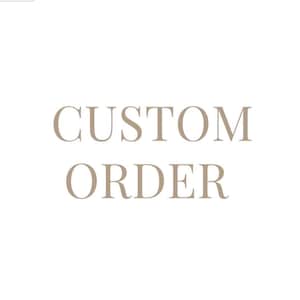 May include: A graphic design featuring the text CUSTOM ORDER in a light beige, serif font centred against a plain white background. The letters are capitalised and arranged in two lines, with the word CUSTOM on top and ORDER on the bottom.