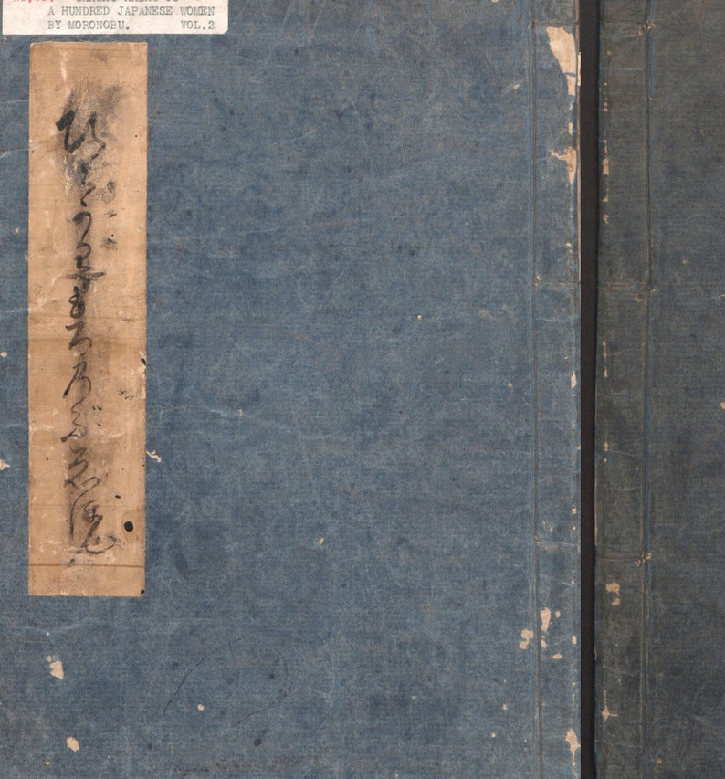 May include: A blue book cover with a tan label on the front. The label has Japanese writing on it and the text "A HUNDRED JAPANESE WOMEN BY MORONOBU, VOL. 2".