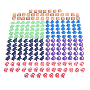 May include: A set of 100 colorful game pieces, including toast, leaves, gems, anvils, potion bottles, and hearts. The pieces are arranged in rows on a white background.