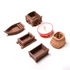 May include: A set of six miniature wooden objects, including a boat, a basket, a crate, a box, a well, and a mushroom. The objects are all brown and are made of wood.