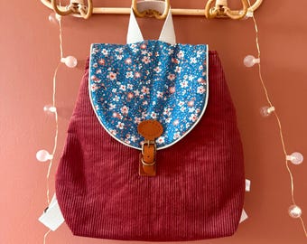 Customizable school backpack for nursery and preschool in magenta corduroy with blue flowers