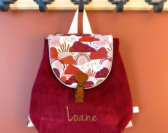 Customizable nursery and kindergarten backpack in terracotta magenta marsala corduroy for children with rainbow