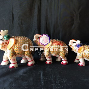 Line of Marble Elephant Figurine with real Gold painted Elephant Statue Elephant Sculpture for Home Décor.