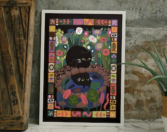 May include: A framed print of a black cat sitting in a stone basin surrounded by colorful flowers and a patterned border. The cat is looking at another cat in the basin.