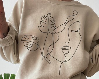 Tröja med abstrakt ansikte | Tröja med en linjekonst | Tröja med monsterablad | Minimalistiska botaniska kläder