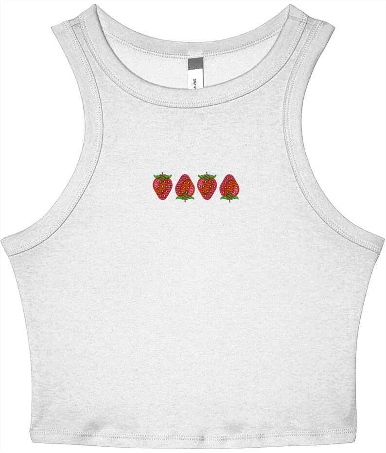 May include: A white tank top with a scoop neck and embroidered strawberries. The strawberries are red with green leaves and are arranged in a horizontal line across the chest. The tank top is made of a soft, lightweight material.