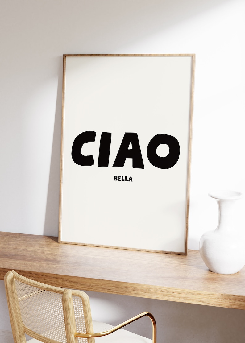 CIAO large in black and BELLA in a much smaller size directly underneath