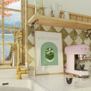 Print mockup of - Iced matcha written at the top in green, green arch with white stars and photo of Iced Matcha on top. Matcha Powder • Milk • Ice Cubes written underneath.