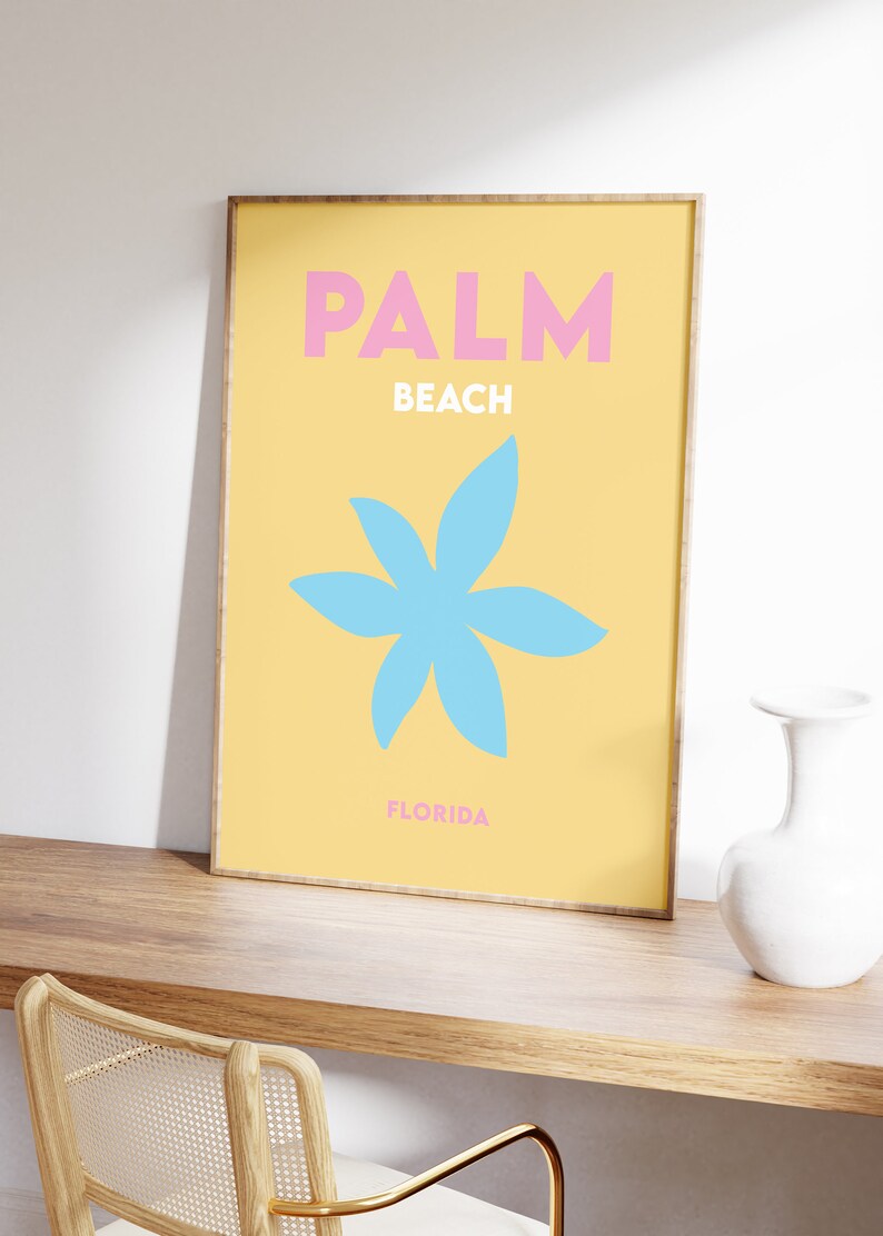 Palm beach florida text in pink and white on a yellow background with a blue flower illustration