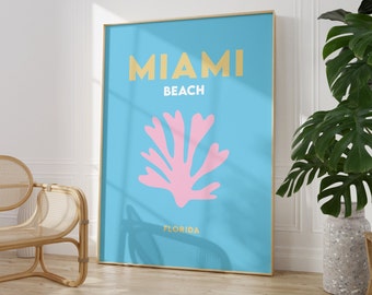 May include: A blue and gold poster with the text "Miami Beach, Florida" and a pink coral design.