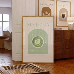 Print mockup of - Matcha written at the top in green, green arch with white stars and photo of Matcha on top. Matcha Powder • Hot Water • Steamed Milk written underneath.