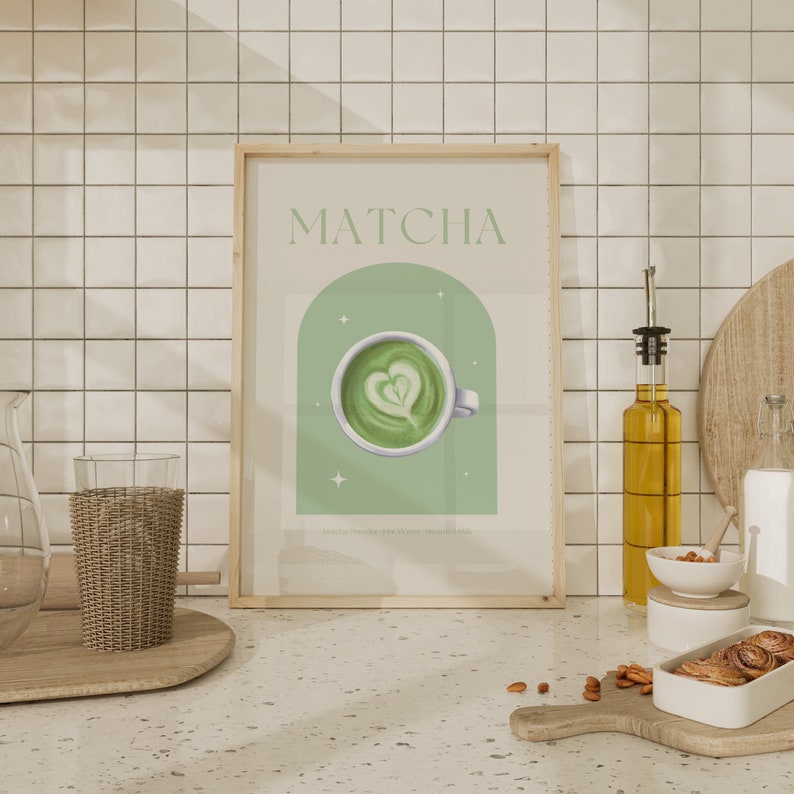 Print mockup of - Matcha written at the top in green, green arch with white stars and photo of Matcha on top. Matcha Powder • Hot Water • Steamed Milk written underneath.