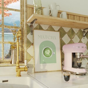 Print mockup of - Matcha written at the top in green, green arch with white stars and photo of Matcha on top. Matcha Powder • Hot Water • Steamed Milk written underneath.