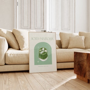 Print mockup of - Iced matcha written at the top in green, green arch with white stars and photo of Iced Matcha on top. Matcha Powder • Milk • Ice Cubes written underneath.