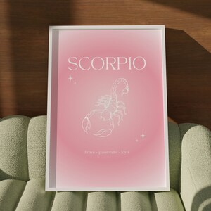 Pink gradient background with white Scorpio text and Scorpion illustration in the middle with brave, passionate, loyal text underneath.