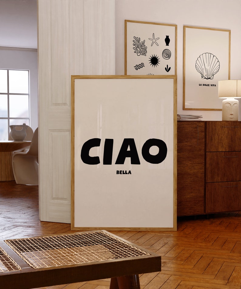 CIAO large in black and BELLA in a much smaller size directly underneath