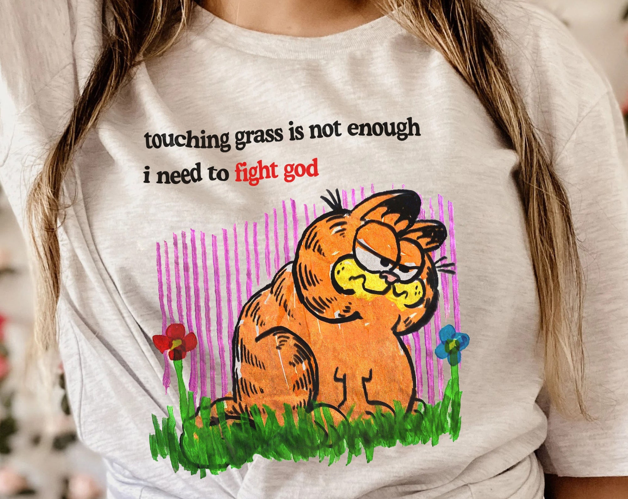 Discover Touching Grass Is Not Enough I Need To Fight God Garfield T-Shirt