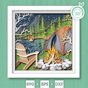 May include: A framed 3D paper art piece depicting a camping scene. The artwork features a tent, campfire, lake, mountains, and a wooden chair. The color palette includes shades of blue, green, orange, and brown. The text "SVG + EPS + DXF" is at the bottom.