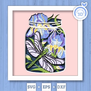 May include: A layered paper art piece featuring a jar filled with purple and yellow irises and a dragonfly. The jar is tied with a white bow. The background is pink, and the frame is white. The image includes the text "original design 3D SHOPATH" and "SVG + EPS + DXF".