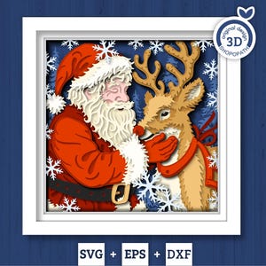 May include: A framed paper art piece depicting Santa Claus and a reindeer. Santa, in a red suit and hat, is nose-to-nose with the reindeer, which wears a red scarf. The background shows snowflakes and a blue forest scene, within a white frame.
