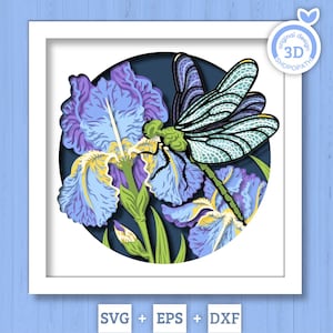May include: A 3D layered paper art piece featuring a dragonfly perched on iris flowers. The artwork is set within a white square frame, with the dragonfly in shades of green and blue, and the irises in purple and yellow. The background is a dark blue circle.