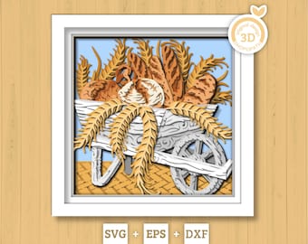 May include: A 3D paper art piece featuring a white cart filled with various types of bread and wheat stalks. The artwork is framed in a white square frame, with a light blue background. The image includes the text "SVG + EPS + DXF".