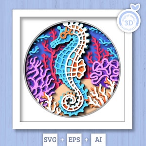 May include: A 3D paper cut design of a blue and orange seahorse surrounded by coral in shades of pink, purple, and white. The design is in a white frame against a light blue wood background.