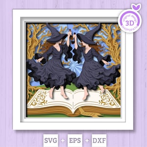 Könnte beinhalten: Gerahmtes 3D-Papierkunstwerk mit zwei Hexen in schwarzen Kleidern und Hüten, die Flaschen halten und auf einem offenen Buch tanzen. Das geschichtete Design umfasst einen Waldboden und das Wort "Sisters" auf dem Buch.