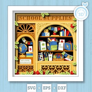 以下が含まれることがあります： SCHOOL SUPPLIES、WELCOME STUDENTS、LEARN、BE KINDの文字が書かれた、学校用品店の多層ペーパーカットシャドーボックス。地球儀、本、バックパック、ランチボックス、鉛筆、絵の具セットが黄色いフレームの中に配置されています。
