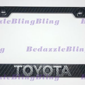 3D Toyota Carbon Fiber Emblem On Carbon Fiber Style License Plate Frame W/ Carbon Fiber Style Bolt Caps