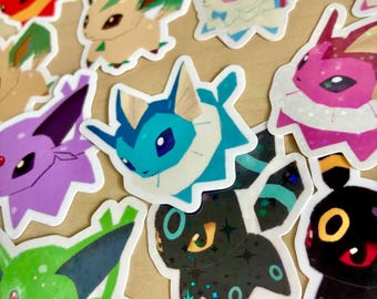 Eeveeloutions Poké Stickers 2” Glossy Holographic