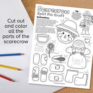 May include: Black and white printable craft activity for kids to cut out, color, and assemble a scarecrow. The printable includes a head, body, arms, legs, boots, a flower, corn, and a pocket. The instructions include a tip on how to make holes for the split pins.